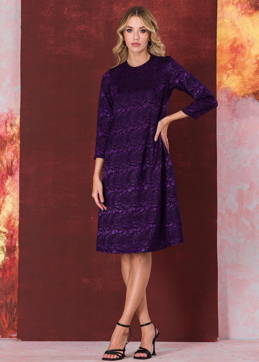 Three quarter sleeve brocade dress with round neck