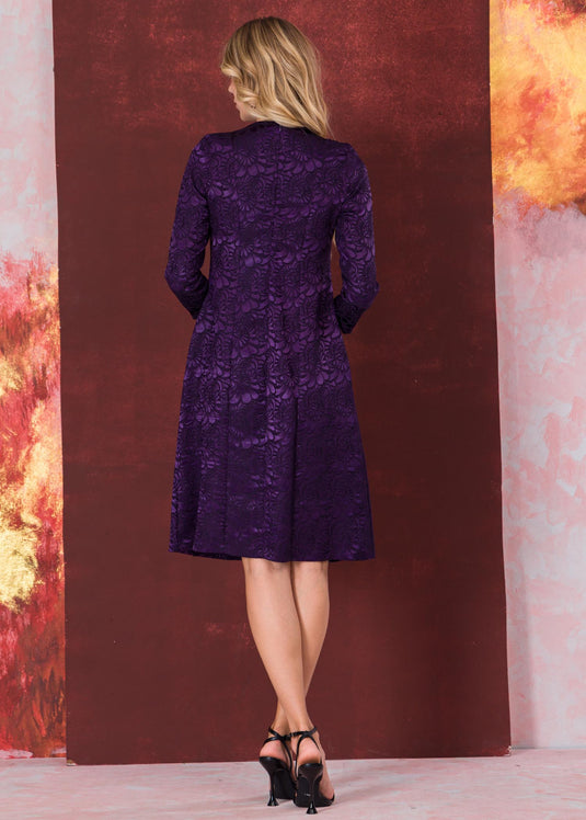 Three quarter sleeve brocade dress with round neck