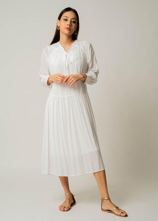 Drop waist long sleeve dress with front tie